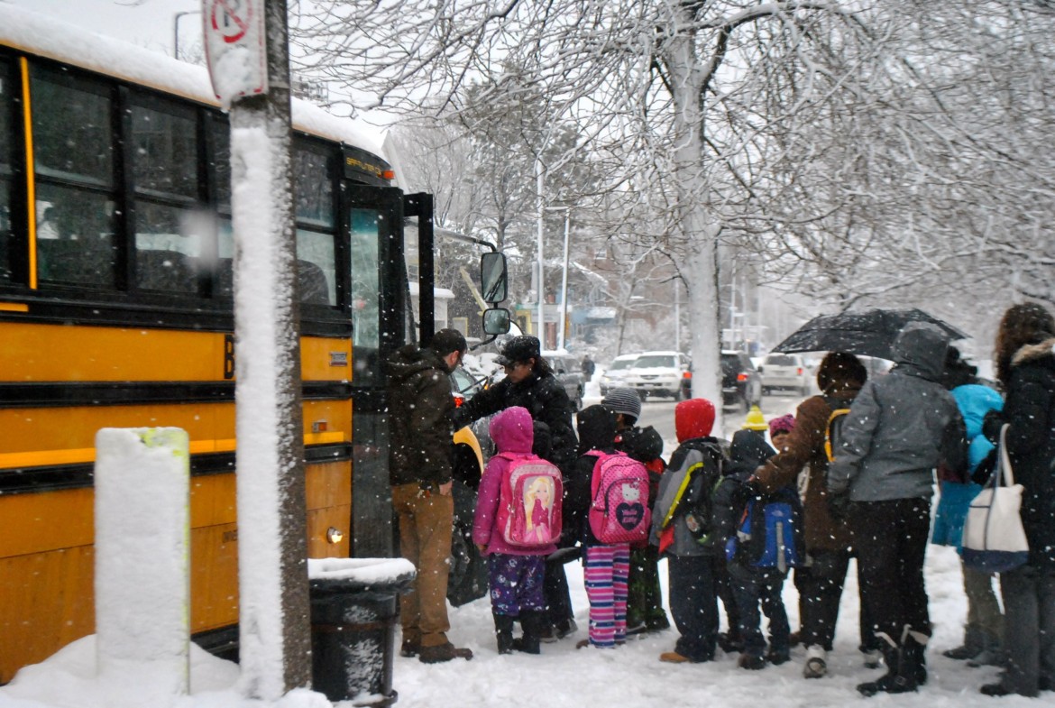 Students from the Curley board their bus on Feb. 13, 2014.