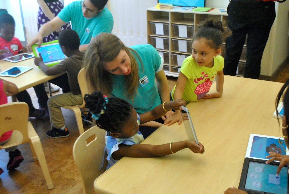 Students use tablet computers on the day of the ribbon-cutting for Nurtury Learning Lab on June 16, 2014.