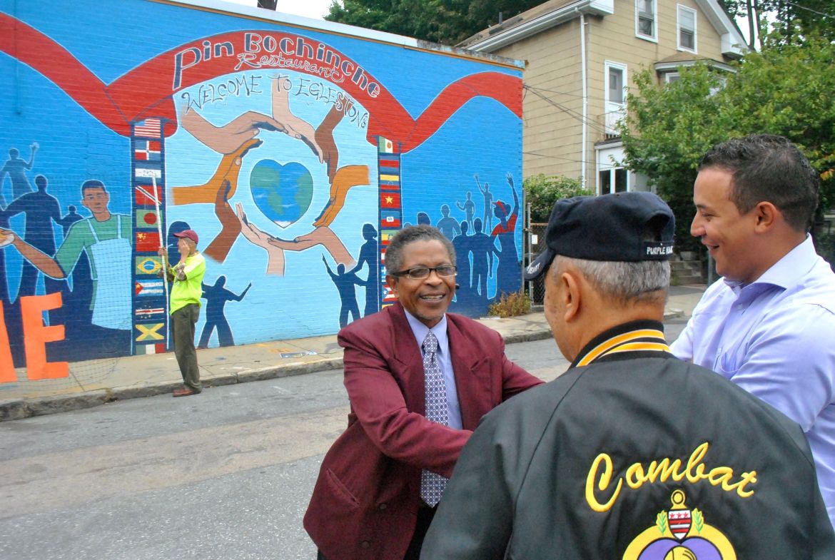 Santo Ramírez, one of the store owners being evicted from City Realty property on Washington Street, shakes hands with supporters during a rally on Sept. 16, 2014.