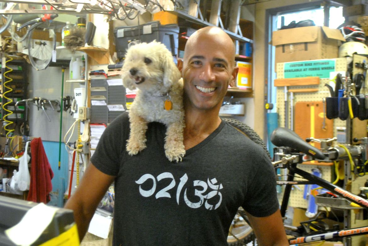 Anthony Stamp and his 13-year-old dog, Precious, pause for a photo at Ferris Wheels Bike Shop on Wednesday, Sept. 17, 2014.