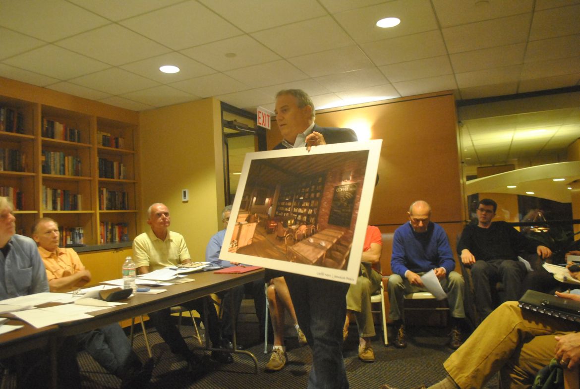 Jay Gentile, director of Caffè Nero's U.S. operations, shows a rendering of the chain's proposed JP location to board members of the Pond Association on Monday, Sept. 8, 2014.