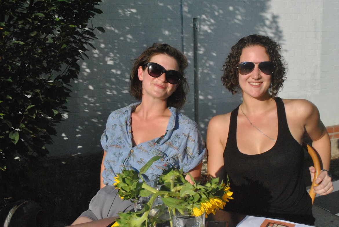 Lauren Nathan, board member of JP Centre/South Main Streets, and Mira Stella, bar manager at Tres Gatos, worked the entry table at a JP Music Festival Fundraiser at Tres Gatos on Monday, Aug. 25, 2014.