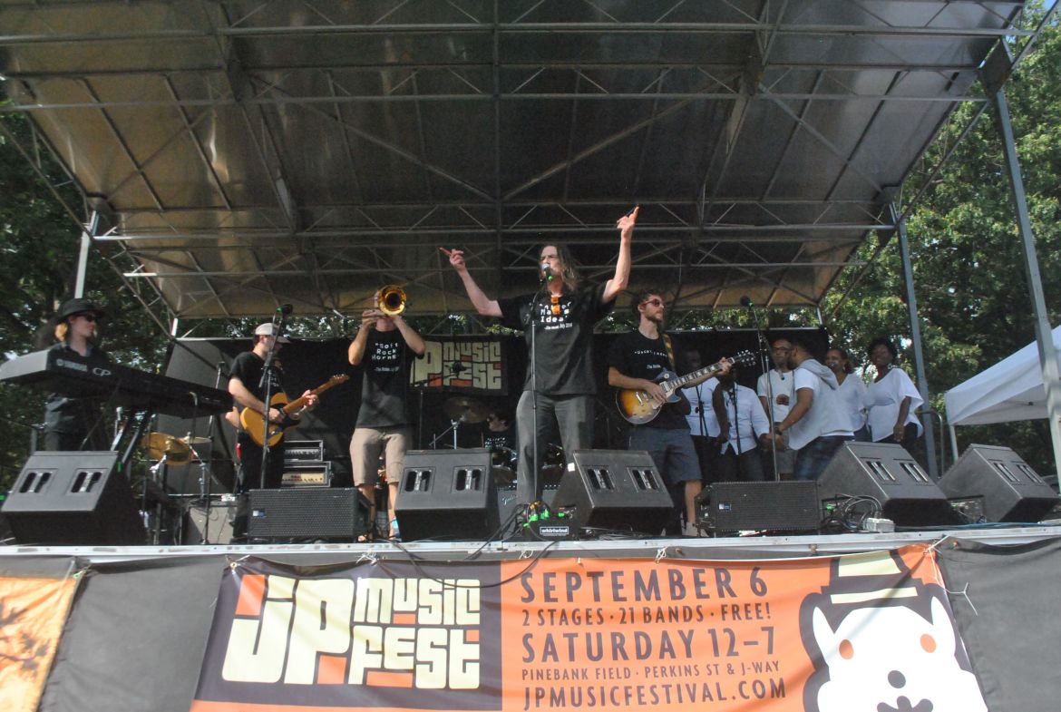 Rick Berlin, center, and the Nickel & Dime Band, accompanied by Praise & Worship Team from Bethel AME Zion Church, at the Jamaica Plain Music Festival, Saturday, Sept. 6, 2014.
