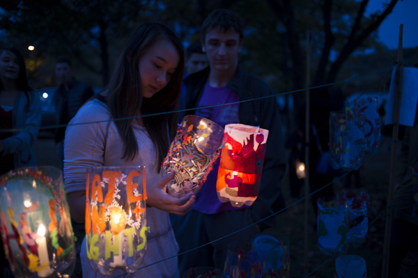 Victoria Wu studies one of many lanterns for sale at the Jamaica Pond Lantern Parade on Oct. 18, 2014.