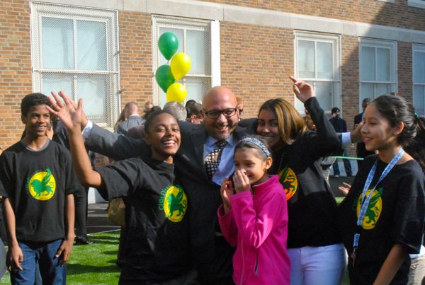 State Rep. Jeffrey Sánchez celebrates with students at the ribbon cutting for the new playing field at Curley K-8 School on Tuesday, Oct. 28, 2014.