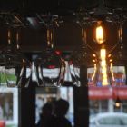 A view through hanging wine glasses toward the dining area of Centre Street Cafe on Sunday, Nov. 2, 2014.