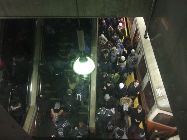 Riders leave a crowded Orange Line train, Feb. 4, 2015.