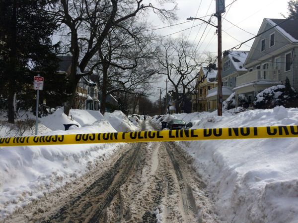 One of the residential streets in Pondside blocked off by police tape after a fatal shooting at 891 Centre St., Wednesday, Feb. 11, 2015.