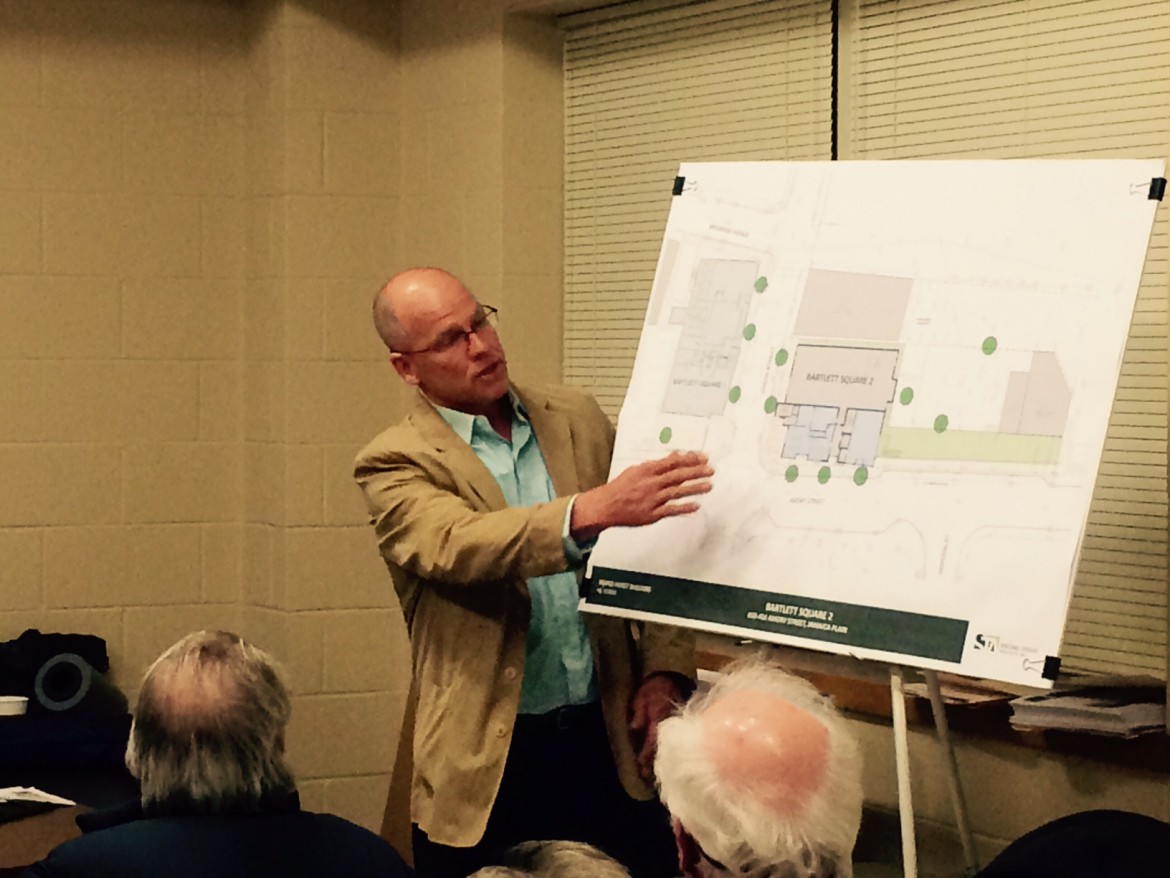 JP developer Chris DeSisto points to a feature on a rendering of "Bartlett Square 2" at a JP Neighborhood Council committee meeting at the police station on Tuesday, March 3, 2015.