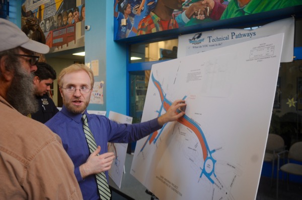 Jonathan Kapust, right, head highway engineer for the Casey Arborway, explains a design feature to JP's Jake Hart before a Thursday, May 7, 2015 construction meeting.