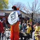 The Wake Up The Earth Parade (Egleston Square branch) makes its way to the festival.