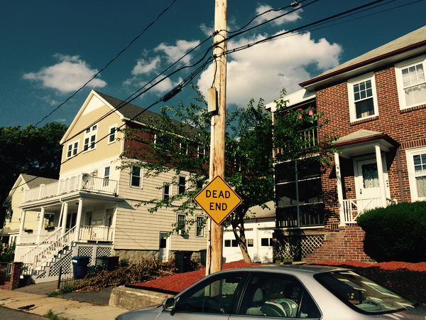 At left is the home of State Senator Sonia Chang-Díaz, D-Jamaica Plain. Neighbor Brian Wells, of 64 Orchardhill Road, on the right, sued her family over a third-floor renovation. Monday, July 20, 2015.
