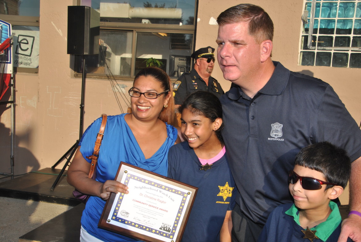 File photo: Mayor walsh congratulates Dr Christine Ragbir for her community service award. She is joined by her sons.