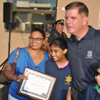 File photo: Mayor walsh congratulates Dr Christine Ragbir for her community service award. She is joined by her sons.