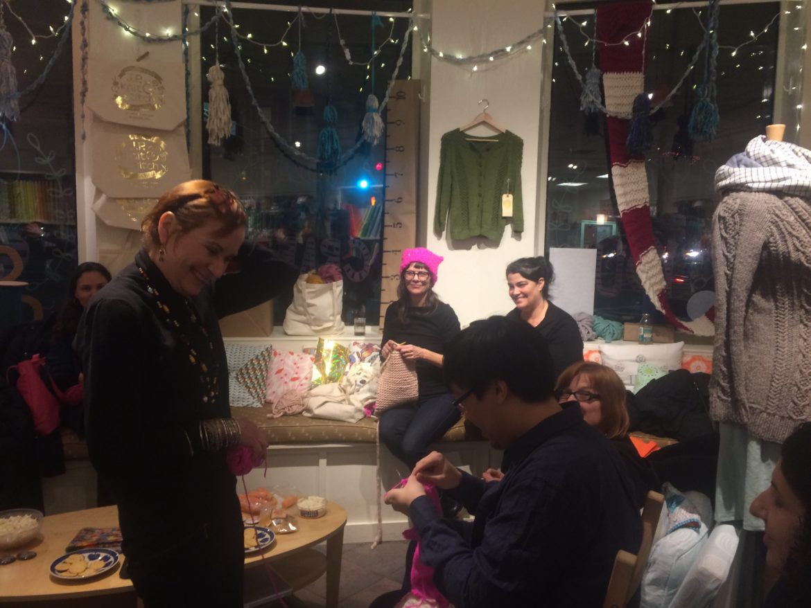 Genevieve Day, center, co-owner of JP Knit & Stitch, participates in the weekly Stitch Night at her Hyde Square business on Friday, Jan. 20, 2017.