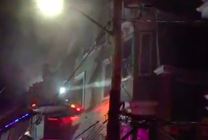 Screen shot from video of Boston Fire knocking out windows at 12-14 Creighton St. on Dec. 31, 2016.