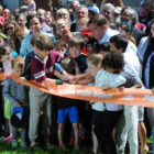 Mayor Marty Walsh and neighborhood kids cut the ribbon at the reopening of the JP Branch Library on Saturday, May 20, 2017.
